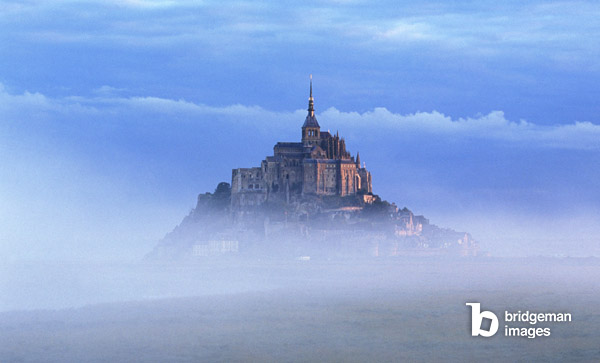 France, Normandy, Mont Saint Michel, seen through early morning fog